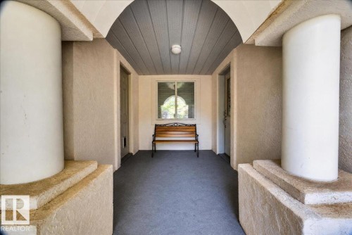 Covered entry with textured walls, an arched ceiling with plank finish, and recessed lighting - 121 51205 Range Road 195, Rural Beaver County, AB - 