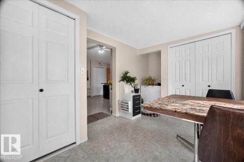 White paneled bi-fold doors, neutral wall paint, and light-toned flooring - 121 51205 Range Road 195, Rural Beaver County, AB - Indoor