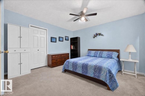 Wall-to-wall carpeting and a ceiling fan with integrated lighting - 121 51205 Range Road 195, Rural Beaver County, AB - Indoor Photo Showing Bedroom