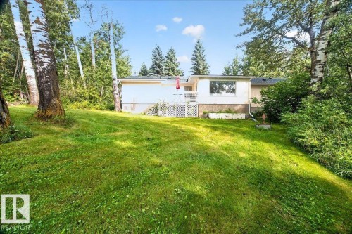 Expansive green lawn with mature trees, offering a private outdoor environment - 121 51205 Range Road 195, Rural Beaver County, AB - Outdoor