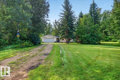 Ranch-style residence featuring a two-car attached garage and a gravel driveway - 121 51205 Range Road 195, Rural Beaver County, AB - Outdoor