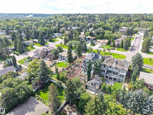 Aerial perspective showcasing a residential lot with surrounding mature trees and established neighborhood - 8203 134 Street Nw, Edmonton, AB 