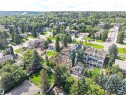 Aerial perspective showcasing a residential lot with surrounding mature trees and established neighborhood - 8203 134 Street Nw, Edmonton, AB 