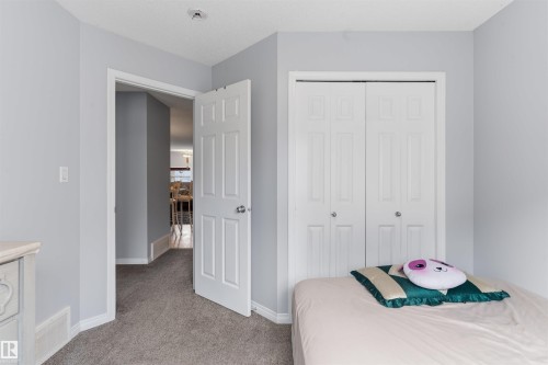 Plush carpeting throughout, white paneled doors, and a built-in bi-fold closet - #30 3305 Orchards Link Sw Sw, Edmonton, AB 