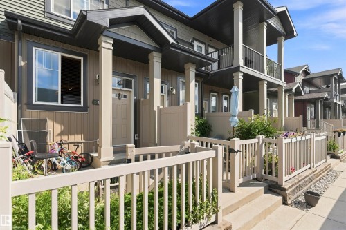Multi-level exterior with siding, individual entry patios, and upper-level balconies - #30 3305 Orchards Link Sw Sw, Edmonton, AB 