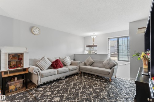 Recessed lighting, light gray wall color, textured ceiling, window with blinds - #30 3305 Orchards Link Sw Sw, Edmonton, AB 