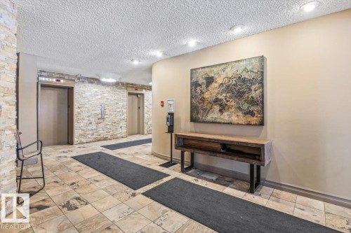 #1004 10045 117 St Nw, Edmonton, AB - Indoor With Fireplace
