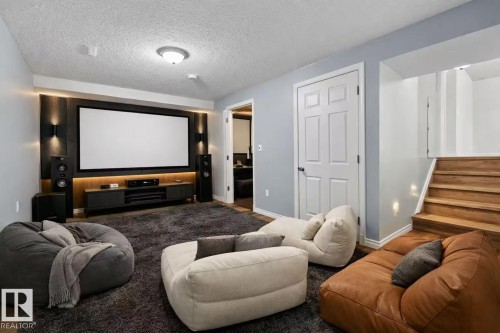 Dedicated media wall with large screen and built-in display console - 4209 25 Avenue Nw, Edmonton, AB - Indoor