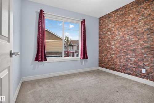 #69 3625 144 Av Nw, Edmonton, AB - Indoor Photo Showing Other Room