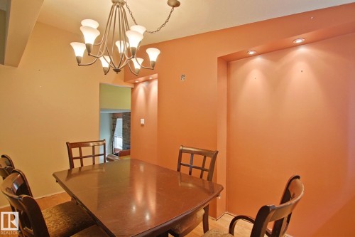Recessed lighting and a decorative chandelier illuminate the space - 18107 89 Avenue Nw, Edmonton, AB - Indoor Photo Showing Dining Room