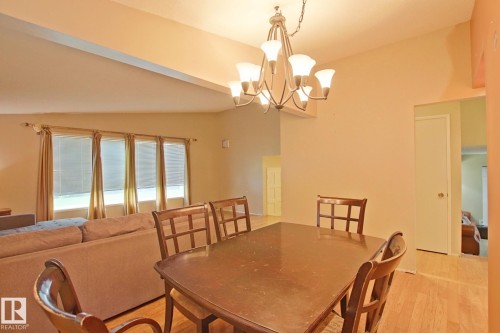 Recessed ceiling, wood-finish flooring, and a multi-light chandelier - 18107 89 Avenue Nw, Edmonton, AB - Indoor Photo Showing Dining Room
