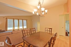 Recessed ceiling, wood-finish flooring, and a multi-light chandelier - 