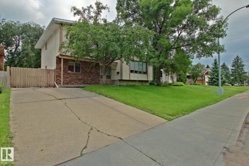 Two-story residence featuring a brick facade and light-toned siding - 18107 89 Avenue Nw, Edmonton, AB - Outdoor