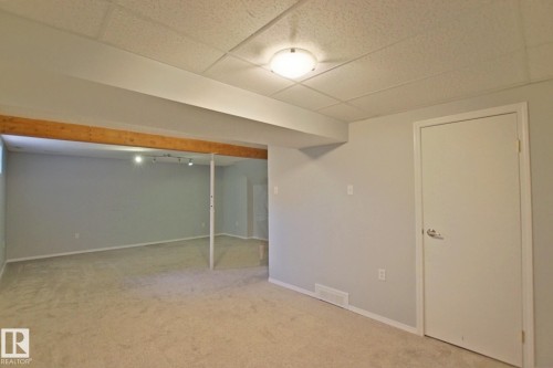 Carpeted flooring, neutral wall tones, recessed ceiling lighting, and a drop ceiling - 18107 89 Avenue Nw, Edmonton, AB - Indoor Photo Showing Other Room