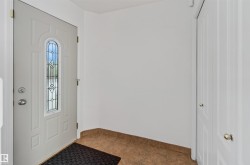 White entry door with decorative glass insert - 