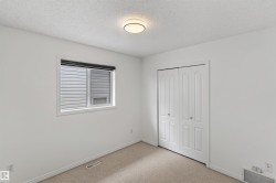 Carpet flooring, white walls, bi-fold closet doors, recessed window, and ceiling-mounted light fixture - 