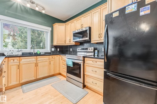 1508 68 Street Sw, Edmonton, AB - Indoor Photo Showing Kitchen With Double Sink