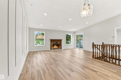 Wood-finish flooring, recessed lighting, and a wood-mantel fireplace - 