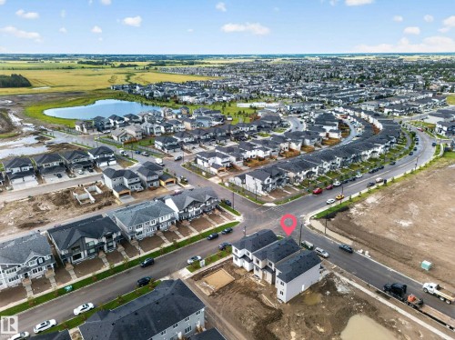 Developing neighborhood with a central pond and established residential streets - 222 Black Stone Drive Drive, Leduc, AB - Outdoor With View