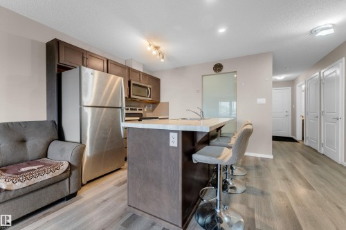 #227 148 Ebbers Bv Nw, Edmonton, AB - Indoor Photo Showing Kitchen With Stainless Steel Kitchen