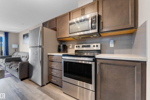 #227 148 Ebbers Bv Nw, Edmonton, AB - Indoor Photo Showing Kitchen With Stainless Steel Kitchen