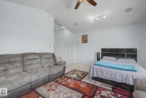 Carpeted flooring with white walls, a ceiling fan, and recessed lighting - 3236 21 Street Nw, Edmonton, AB - Indoor Photo Showing Bedroom