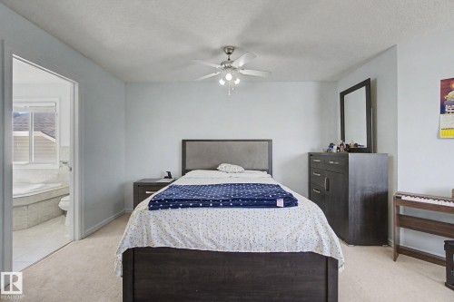 Carpeted flooring with an overhead ceiling fan - 3236 21 Street Nw, Edmonton, AB - Indoor Photo Showing Bedroom
