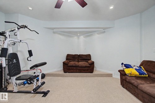Carpeted room with recessed lighting, ceiling fan, and built-in projector screen - 3236 21 Street Nw, Edmonton, AB - Indoor