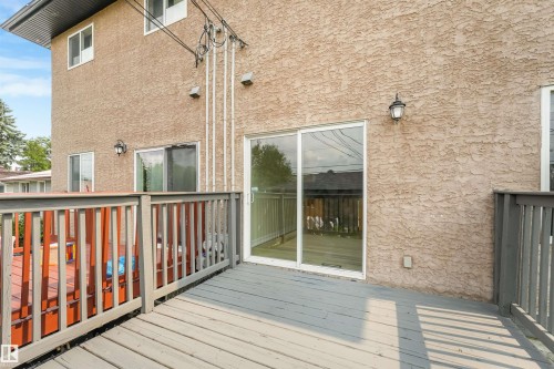 Expansive outdoor deck with gray wood-finish flooring and railings - 10234 155 Street Nw, Edmonton, AB - Outdoor With Deck Patio Veranda With Exterior
