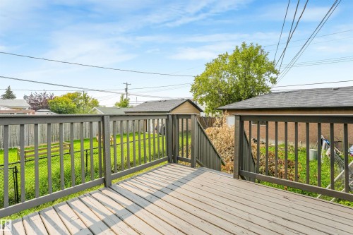 Wood deck with painted railings, providing an elevated outdoor space - 10234 155 Street Nw, Edmonton, AB - Outdoor With Deck Patio Veranda With Exterior