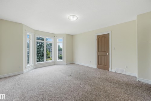 Bay window with multiple panels and white trim - 10234 155 Street Nw, Edmonton, AB - Indoor Photo Showing Other Room