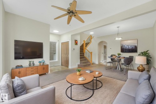 Open-concept living area featuring a ceiling fan, recessed lighting, and hardwood flooring throughout - 10234 155 Street Nw, Edmonton, AB - Indoor Photo Showing Living Room