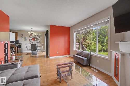 Hardwood-style flooring throughout - 9935 155 Street Nw, Edmonton, AB - Indoor Photo Showing Living Room