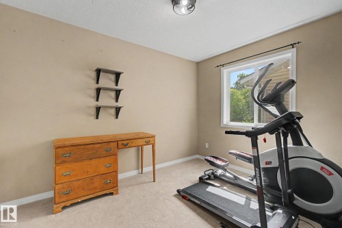 Neutral-toned wall paint and recessed ceiling light - 9935 155 Street Nw, Edmonton, AB - Indoor Photo Showing Gym Room