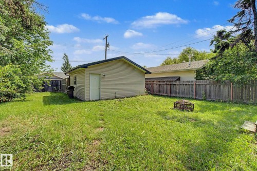 Detached garage with siding exterior and a single entry door - 9935 155 Street Nw, Edmonton, AB - Outdoor