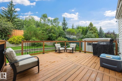 Expansive wood deck with wood-finish railings and black metal spindles - 15 Orchid Place, St. Albert, AB - Outdoor With Deck Patio Veranda With Exterior