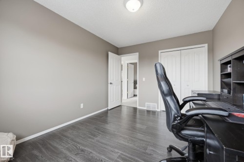 Wood-finish flooring, neutral wall paint, and overhead lighting - 15 Orchid Place, St. Albert, AB - Indoor