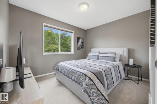 Neutral wall color, carpeted flooring, a single window, and a flush-mount ceiling light fixture - 15 Orchid Place, St. Albert, AB - Indoor Photo Showing Bedroom