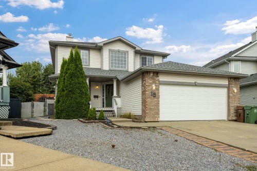 Two-story home with light siding and brick accents - 15 Orchid Place, St. Albert, AB - Outdoor