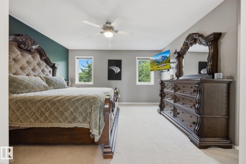 Wall-to-wall carpeting, multiple windows, and a ceiling fan - 15 Orchid Place, St. Albert, AB - Indoor Photo Showing Bedroom