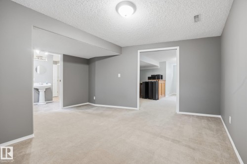 Carpeted flooring, recessed lighting, and a neutral color palette - 15 Orchid Place, St. Albert, AB - Indoor Photo Showing Other Room