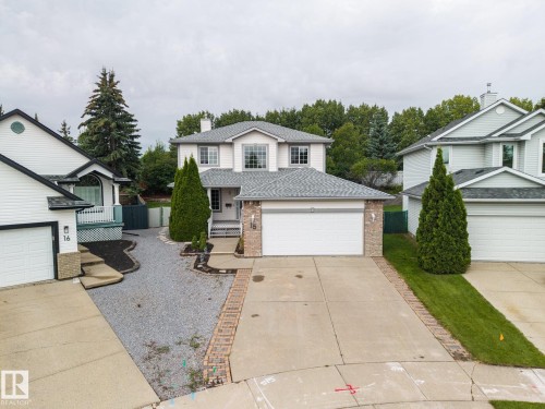 Two-story residence featuring light siding and a gray shingle roof - 15 Orchid Place, St. Albert, AB - Outdoor