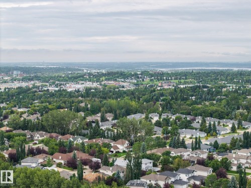 Residential area with extensive tree coverage and a distant body of water - 15 Orchid Place, St. Albert, AB - Outdoor With View