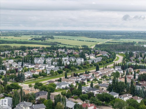 Established residential neighborhood with mature trees, paved streets, and a variety of home styles - 15 Orchid Place, St. Albert, AB - Outdoor With View