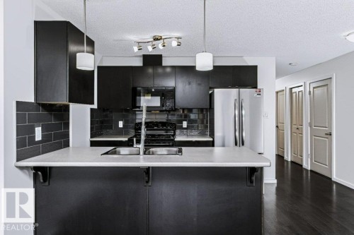 #415 508 Albany Way Nw, Edmonton, AB - Indoor Photo Showing Kitchen With Double Sink With Upgraded Kitchen