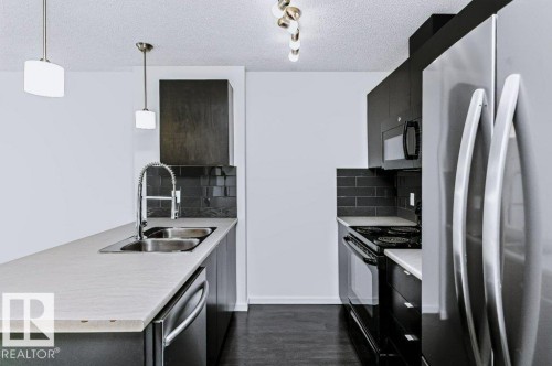 #415 508 Albany Way Nw, Edmonton, AB - Indoor Photo Showing Kitchen With Double Sink With Upgraded Kitchen