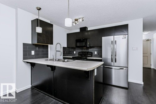 #415 508 Albany Way Nw, Edmonton, AB - Indoor Photo Showing Kitchen With Double Sink