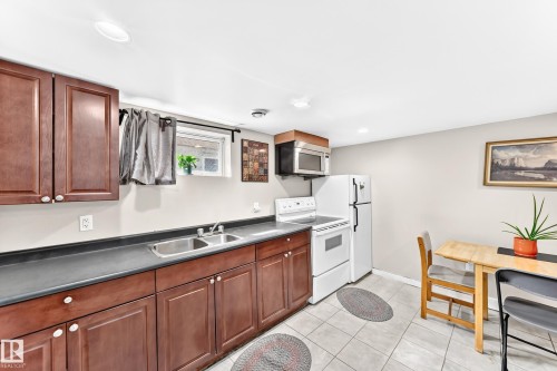 12031 90 Street Nw, Edmonton, AB - Indoor Photo Showing Kitchen With Double Sink