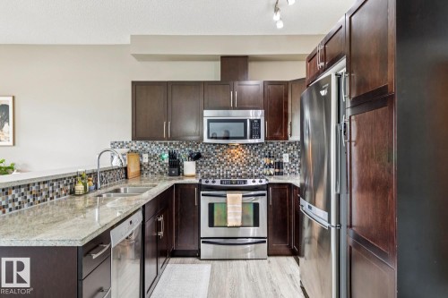 #104 9603 98 Av Nw, Edmonton, AB - Indoor Photo Showing Kitchen With Double Sink With Upgraded Kitchen