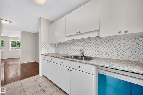 #14 14803 34 St Nw, Edmonton, AB - Indoor Photo Showing Kitchen With Double Sink